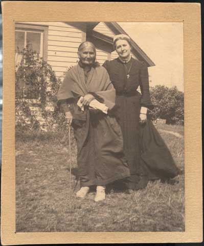 Black and white photograph of Sarah Good Thunder and Evangeline Whipple, ca. 1905.