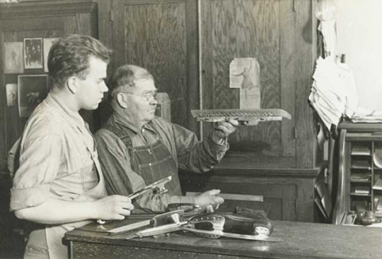 John E. Strauss Jr. and Sr. in skate shop