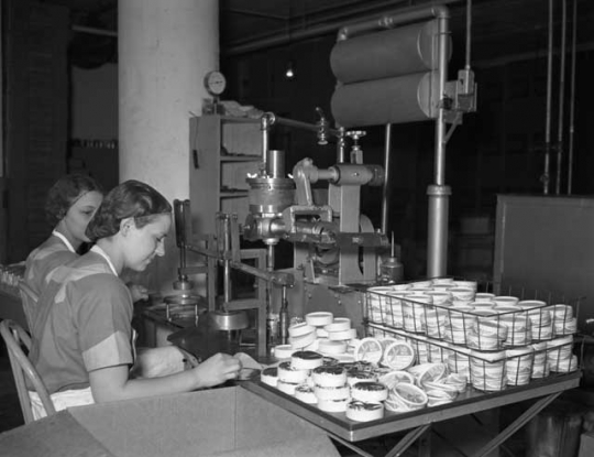 Women packing Red Mill cheese products