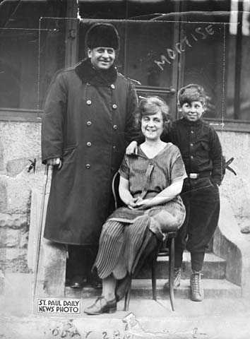 Thomas D. Schall with his wife and son