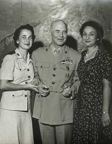 Black and white photograph of Melvin J. Maas with daughter Patricia and wife Katherine, 1952.