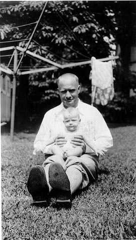 Black and white photograph of Delos Lovelace with his daughter, Merion, c.1931.