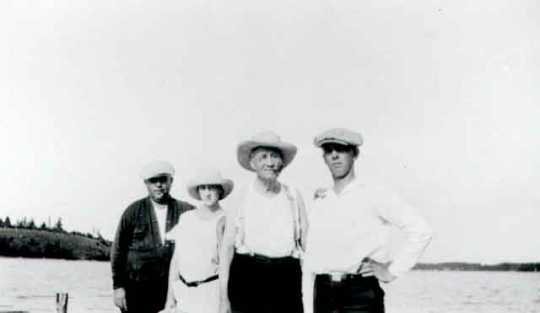 Black and white photograph of Daniel Hogan (far left) and family, c.1926. Hogan was was instrumental in the operation of the O'Connor system.