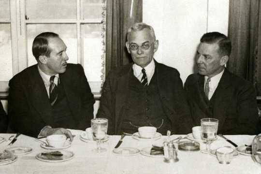 Black and white photograph of Howard Kahn, City Editor of the St. Paul Daily News (far right) with Webb Miller of United Press (center) and J. N. Jackson, President of the St. Paul Association