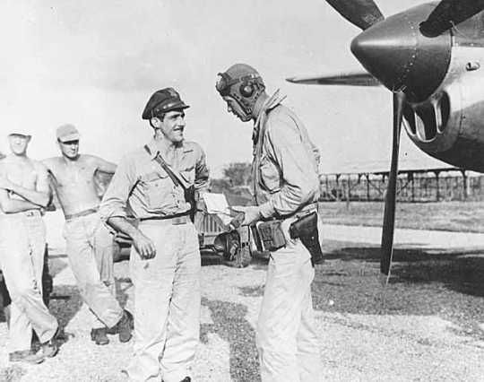 Black and white photograph of Charles Augustus Lindbergh with Tommy McGuire in the South Pacific, 1944.