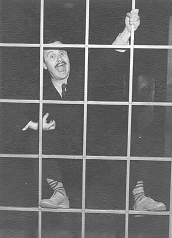 Black and white photograph of Clement Haupers clowning around, c.1931.