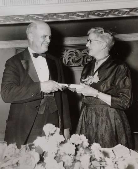 Black and white photograph of Frances E. Andrews at a National Audubon Society dinner, 1954.