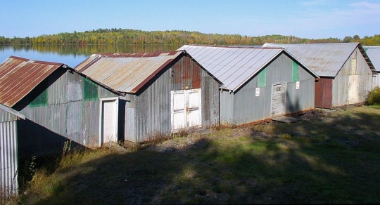 Color image of the Stuntz Bay boathouses on Lake Vermilion, Soudan Underground Mine State Park, 2011.