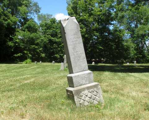 Color image of a tilted headstone in Pioneers and Soldiers Memorial Cemetery Cemetery in Minneapolis, 2016. Photographed by Paul Nelson.