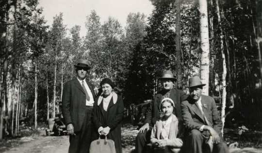 Black and white photograph of Molter family and friend, ca. 1930. 